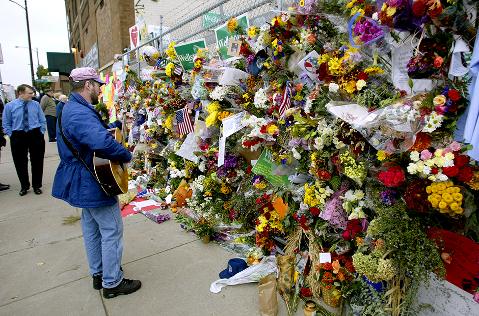 Flowers adorning the fence outside of the campaign headquarters of Sen. Paul Wellstone in St. Paul on October 28, 2002.