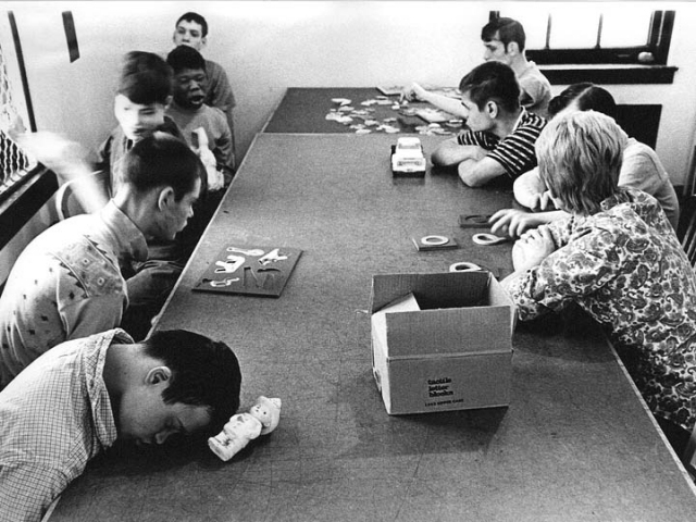 Inmates in a recreation room of Cambridge State Hospital’s Cottage 5, 1970s. From a collection of photographs used as evidence in Welsch v. Likins.