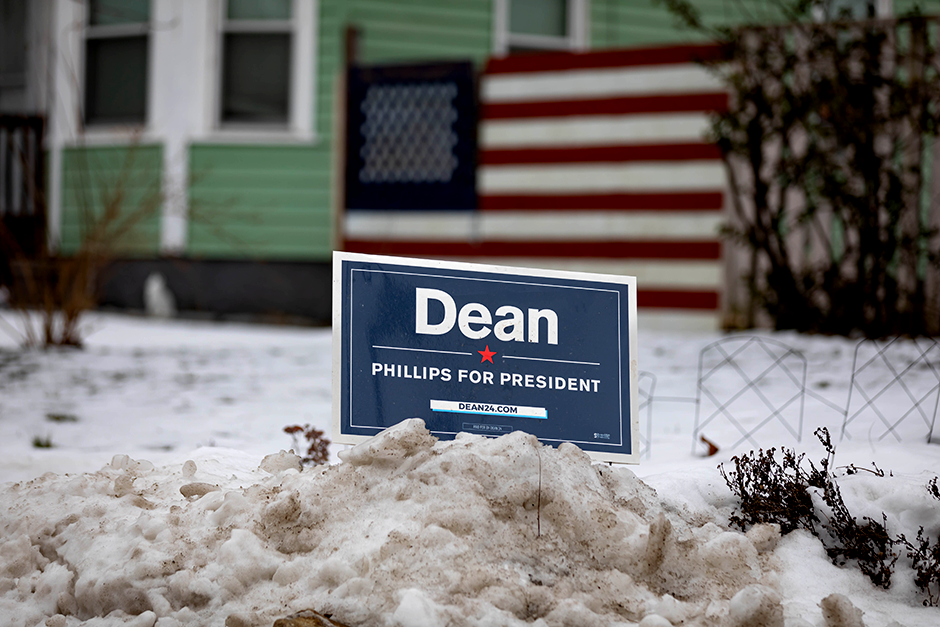 A Dean Phillips for President sign is seen in a snow bank in Manchester, New Hampshire.