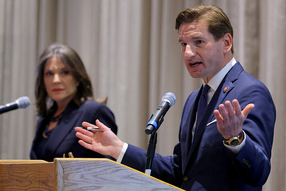Rep. Dean Phillips, right, and author Marianne Williamson taking part in a Democratic Candidate Debate at the NE College Convention 2024 in Manchester, New Hampshire, on Jan. 8.