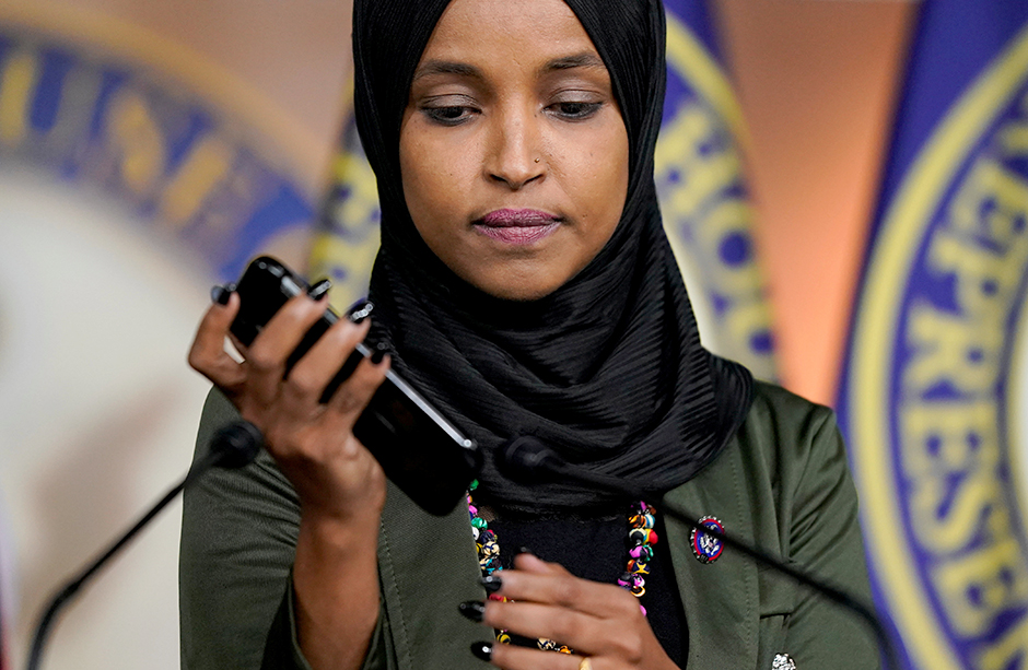 Rep. Ilhan Omar playing a voicemail containing an anti-Muslim message from an unknown person during a news conference on November 30.