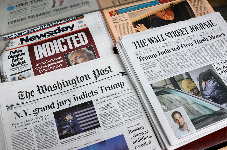 Newspapers shown at a newsstand on Friday following former President Donald Trump's indictment by a Manhattan grand jury.
