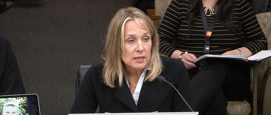Heather Bacchus, displaying an image of her son, testified against the marijuana bill during a House Commerce Finance and Policy Committee meeting on January 11.